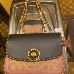 Unique and beautiful coach bag and bonus card holder!!! Only used one time!